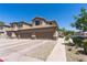 Attached two-car garage with ample driveway space, set within a well-kept community at 6635 Caporetto Ln # 204, North Las Vegas, NV 89084