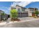 Stylish two-story home with a two-car garage, featuring a basketball hoop and landscaped front yard at 681 Stone Hammer Ave, Las Vegas, NV 89183