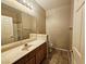 Bathroom featuring single vanity, shower and toilet at 7135 S Durango Dr # 106, Las Vegas, NV 89113