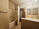 Bathroom with tub, open door, and single vanity at 7135 S Durango Dr # 106, Las Vegas, NV 89113