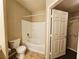 Bathroom featuring a bathtub with a shower and a separate closet with shelving at 7135 S Durango Dr # 106, Las Vegas, NV 89113