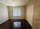 Bedroom with hardwood floors, ample natural light, and a large closet space at 7135 S Durango Dr # 106, Las Vegas, NV 89113