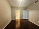 This bedroom has a light-colored walls and wood floor at 7135 S Durango Dr # 106, Las Vegas, NV 89113