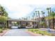 The community entrance features a decorative gate and lush landscaping, giving an inviting feel at 7135 S Durango Dr # 106, Las Vegas, NV 89113