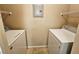 The laundry room has a washer and dryer at 7135 S Durango Dr # 106, Las Vegas, NV 89113