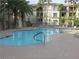 A luxurious community pool offers residents a refreshing escape in a beautiful environment at 7135 S Durango Dr # 106, Las Vegas, NV 89113