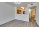 Open living area with modern flooring, view of the kitchen, and access to the bathroom at 7163 S Durango Dr # 302, Las Vegas, NV 89113