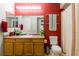 Well-lit bathroom with a large vanity, and shower with curtain at 7255 W Sunset Rd # 2030, Las Vegas, NV 89113