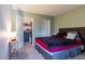 A cozy bedroom with a closet and access to storage space at 7255 W Sunset Rd # 2030, Las Vegas, NV 89113