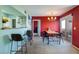 Dining area with bar access, a chandelier, and a sliding glass door for outdoor access at 7255 W Sunset Rd # 2030, Las Vegas, NV 89113