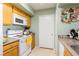 Compact kitchen with standard appliances, practical layout, and ample counter space for cooking at 7255 W Sunset Rd # 2030, Las Vegas, NV 89113