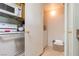 Off kitchen, a discreet door leads to a compact laundry room area at 7255 W Sunset Rd # 2030, Las Vegas, NV 89113