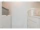 Practical laundry area featuring a standard washer and dryer setup at 7255 W Sunset Rd # 2030, Las Vegas, NV 89113