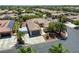 Aerial view of desert home featuring a tile roof, well-manicured landscaping, and long driveway at 7286 Mount Kearsarge St, Las Vegas, NV 89131