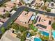This aerial view showcases a single-story home with a tile roof, gated RV parking, and lush landscaping at 7286 Mount Kearsarge St, Las Vegas, NV 89131