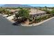 Aerial view of home with tile roof and mature palm trees in a desert landscape at 7286 Mount Kearsarge St, Las Vegas, NV 89131