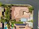 This aerial view captures a single-story residence with a tile roof and secure, gated RV parking at 7286 Mount Kearsarge St, Las Vegas, NV 89131