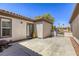 Pavered back patio area offering desert landscaping, home access doors, and wrought iron gate at 7286 Mount Kearsarge St, Las Vegas, NV 89131