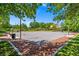 Well-maintained outdoor basketball court surrounded by mature trees, perfect for sports and recreation at 7286 Mount Kearsarge St, Las Vegas, NV 89131