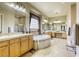 Large bathroom featuring dual vanities, soaking tub and separate shower at 7286 Mount Kearsarge St, Las Vegas, NV 89131