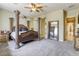 Spacious bedroom featuring a four-poster bed and neutral carpet at 7286 Mount Kearsarge St, Las Vegas, NV 89131