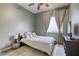 Cozy bedroom featuring a queen-size bed, ceiling fan, and window with light-filtering blinds at 7286 Mount Kearsarge St, Las Vegas, NV 89131