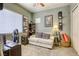 Inviting bedroom with neutral tones, natural light, and a comfortable seating area at 7286 Mount Kearsarge St, Las Vegas, NV 89131
