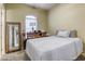 Serene bedroom with soft lighting, neutral walls, and decorative accents for a peaceful ambiance at 7286 Mount Kearsarge St, Las Vegas, NV 89131