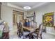 Bright dining room featuring decorative accents, a dark wood table, and tiled flooring at 7286 Mount Kearsarge St, Las Vegas, NV 89131