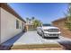 Extended driveway with a silver pickup truck and palm trees in a desert landscape at 7286 Mount Kearsarge St, Las Vegas, NV 89131