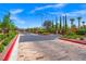 Elegant community entrance gate with lush landscaping, providing privacy and curb appeal at 7286 Mount Kearsarge St, Las Vegas, NV 89131