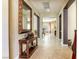 Elegant home entryway boasts tiled floors, sophisticated decor, and arches leading to other rooms at 7286 Mount Kearsarge St, Las Vegas, NV 89131