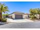 Attractive single-story home showcases a tile roof, a two-car garage, and desert-style landscaping at 7286 Mount Kearsarge St, Las Vegas, NV 89131