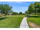 Expansive green space featuring mature trees and a walking path, perfect for outdoor activities at 7286 Mount Kearsarge St, Las Vegas, NV 89131