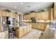 Spacious kitchen featuring granite counters, stainless appliances, and ample cabinetry at 7286 Mount Kearsarge St, Las Vegas, NV 89131