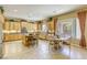 Open kitchen with island, bar seating, and stainless steel appliances at 7286 Mount Kearsarge St, Las Vegas, NV 89131