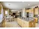 Spacious kitchen with an island and stainless steel appliances at 7286 Mount Kearsarge St, Las Vegas, NV 89131