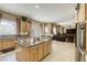 Open kitchen with tile flooring and a granite countertop island at 7286 Mount Kearsarge St, Las Vegas, NV 89131