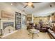 Open-concept living room leading to a kitchen with tile flooring and ample natural light at 7286 Mount Kearsarge St, Las Vegas, NV 89131