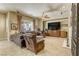 Inviting living room with tile floors, leather furniture, and a cozy fireplace at 7286 Mount Kearsarge St, Las Vegas, NV 89131