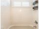 Bathroom bathtub featuring tile surround and a shower fixture at 7540 Flowing Stream Dr, Las Vegas, NV 89131