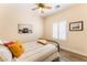 Serene bedroom offers a ceiling fan, plantation shutters, and decor, creating a calming atmosphere at 7540 Flowing Stream Dr, Las Vegas, NV 89131