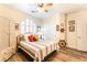 Bedroom featuring nautical decor, light colored walls and laminate flooring at 7540 Flowing Stream Dr, Las Vegas, NV 89131