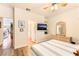 Bedroom with light colored walls featuring a laminate floor and a ceiling fan at 7540 Flowing Stream Dr, Las Vegas, NV 89131