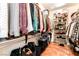 Spacious walk-in closet featuring shelving units for shoes and hanging racks at 7540 Flowing Stream Dr, Las Vegas, NV 89131