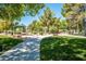 Picturesque community park with walking paths, lush greenery, and shaded picnic areas for residents to enjoy at 7540 Flowing Stream Dr, Las Vegas, NV 89131