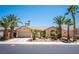 Beautiful single-story home with well-maintained landscaping and several mature palm trees at 7540 Flowing Stream Dr, Las Vegas, NV 89131