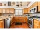 Well-appointed kitchen with stainless steel appliances, granite countertops, and wooden cabinets, ideal for cooking and entertaining at 7540 Flowing Stream Dr, Las Vegas, NV 89131