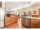 Bright, open kitchen with stainless steel appliances, granite countertops, and breakfast bar flows to dining and living areas at 7540 Flowing Stream Dr, Las Vegas, NV 89131
