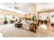 Expansive living room with ample natural light, neutral decor, and seamless flow into other areas at 7540 Flowing Stream Dr, Las Vegas, NV 89131